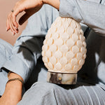 Serena cordless table lamp close-up showing scalloped porcelain shade and marble base