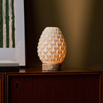 Serena rechargeable table lamp lit at dusk, pink marble base, cozy living room styling