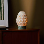 Rechargeable table lamp Serena Ice Green marble, ribbed porcelain shade on dark wood sideboard