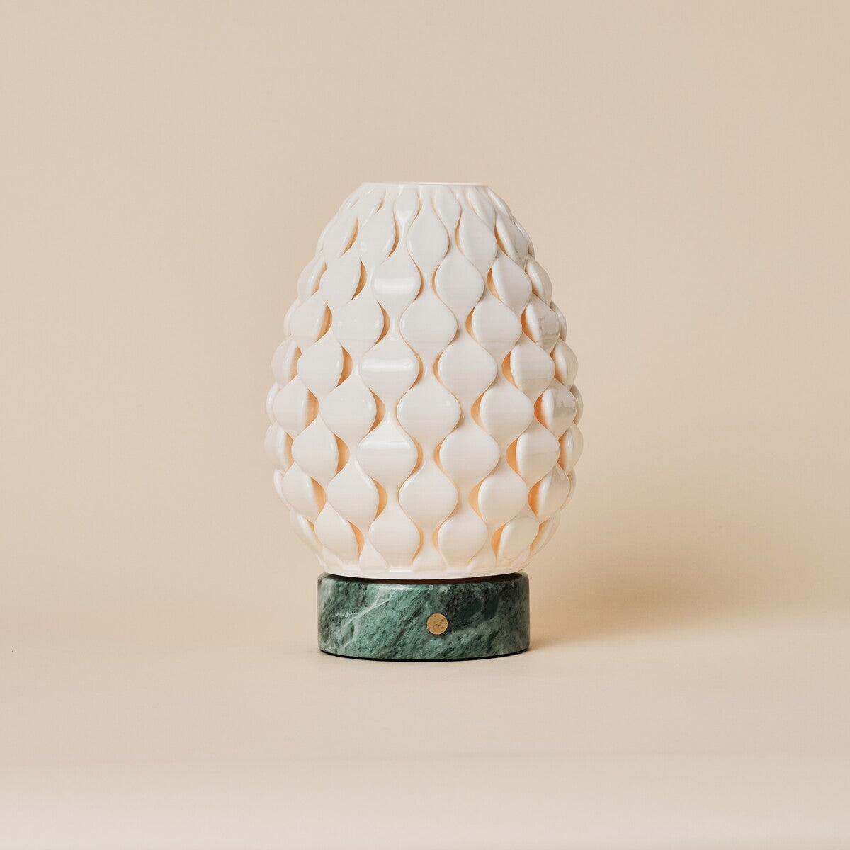 Cordless table lamp Serena Ice Green marble, ribbed porcelain shade on beige studio background