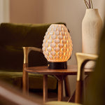 Serena rechargeable table lamp with Nero Marquina black marble base on a wooden side table