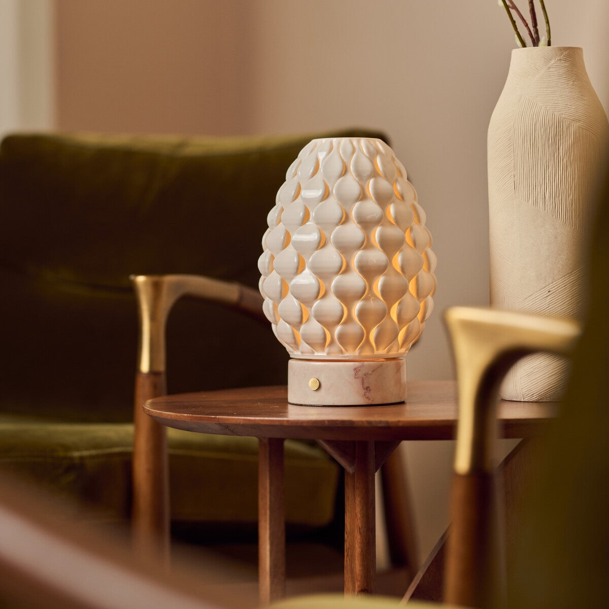 Cordless table lamp Serena Rosa Aurora marble, cream porcelain shade beside vase on wooden table