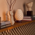 Serena Rosso Levanto marble rechargeable table lamp with scalloped porcelain shade against a beige backdrop