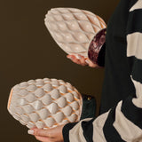 Serena Verde Alpi and Rosso Levanto marble table lamps compared side by side, held in hand