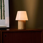 Rechargeable table lamp Jadey Medium, wood base with opal glass shade on cabinet in olive green room