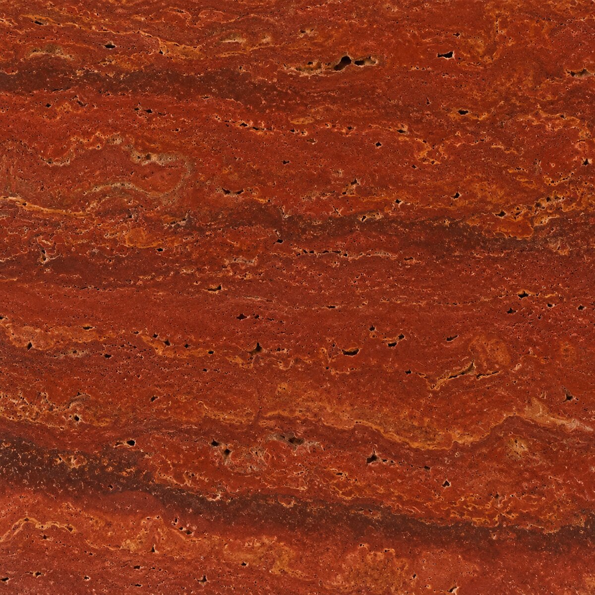 Close-up of raw Red Travertine stone showing deep red and gold veining used for the lamp base