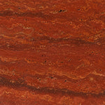 Close-up of raw Red Travertine stone showing deep red and gold veining used for the lamp base