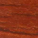 Close-up of raw Red Travertine stone showing deep red and gold veining used for the lamp base