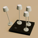 Combi Set Professional – 4 x Vondel Mini Shadow Grey Rechargeable Table Lamps & 1 x Amstel Wireless Charging Station with Q1-Technology Tavellio