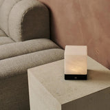 Yce Black Cordless Wooden Lamp glowing softly in a modern interior