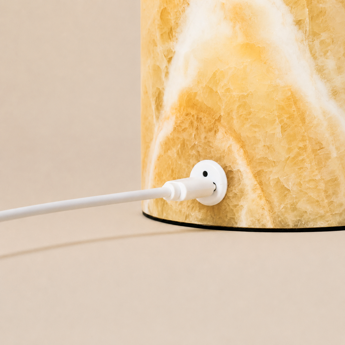 Close-up of the Honey Onyx marble base and USB charging port on the Maes table lamp