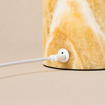 Close-up of the Honey Onyx marble base and USB charging port on the Maes table lamp