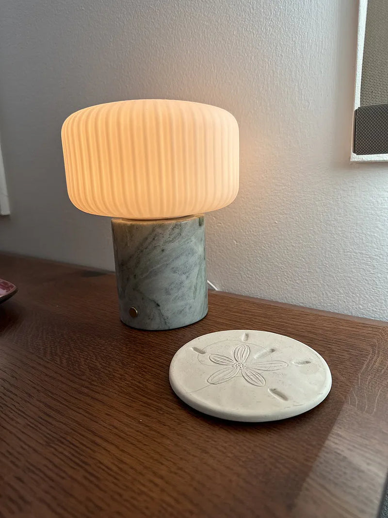 Tavellio wireless lamp adding soft lighting to a customer's reading corner